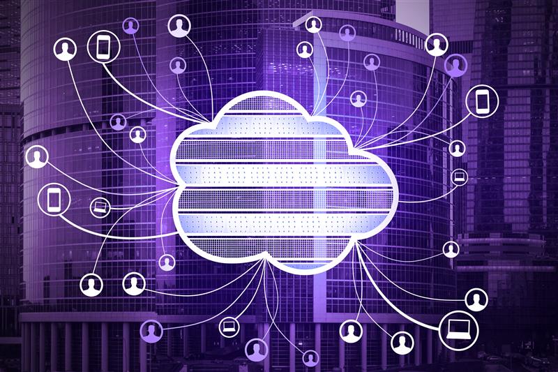 A glowing white cloud icon with server stack lines at its center, connected by lines radiating outward to icons representing users, smartphones, laptops, and tablets, overlaid on a purple-tinted urban skyline with tall glass buildings.